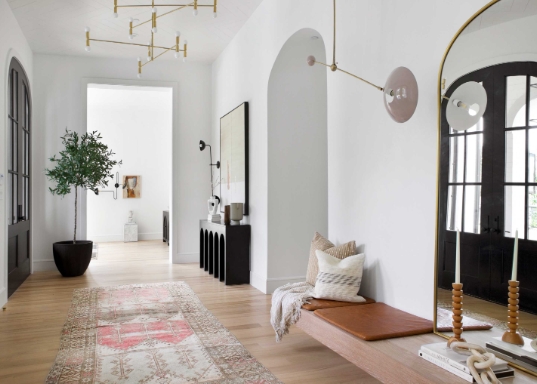Cozy Entryway Decor Using Layered Mirrors and Lighting